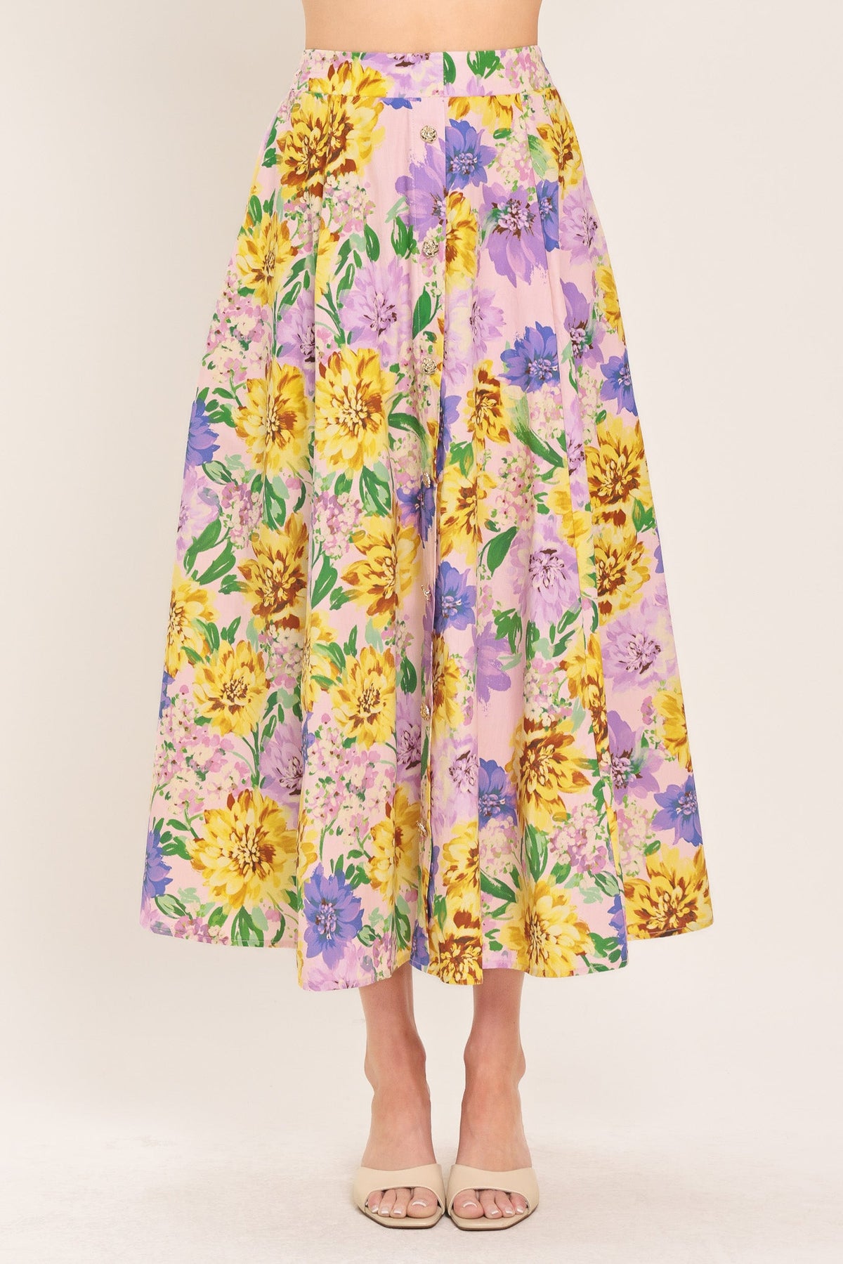 a woman wearing a floral skirt