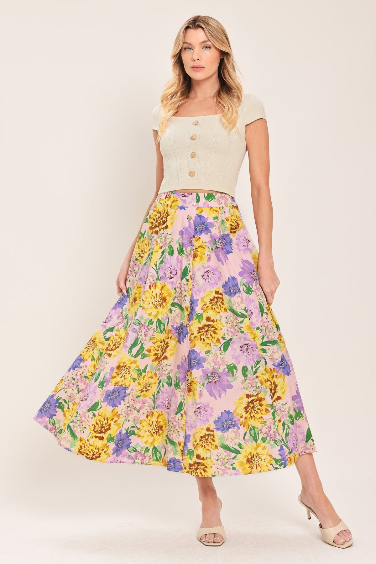 a woman in a floral skirt