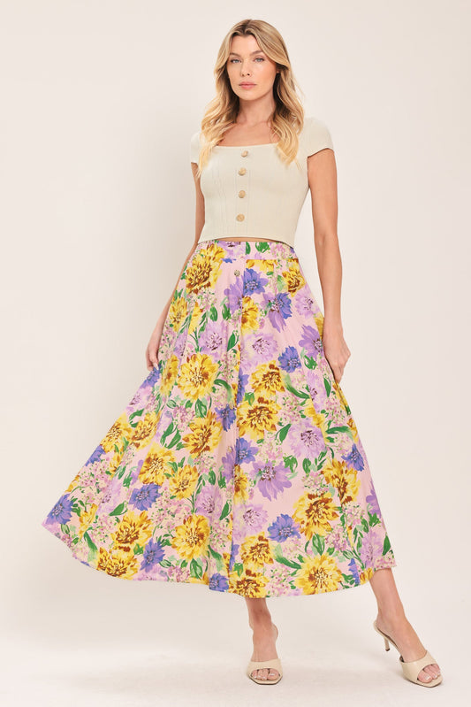 a woman in a floral skirt