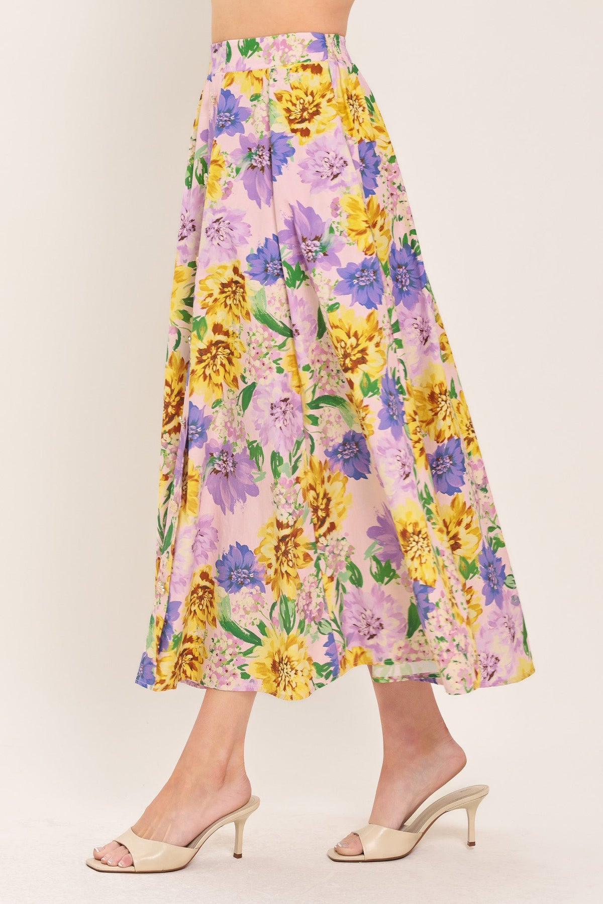 a woman wearing a floral skirt