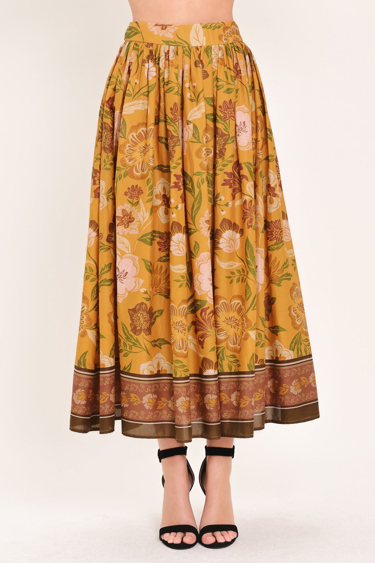a woman wearing a floral skirt