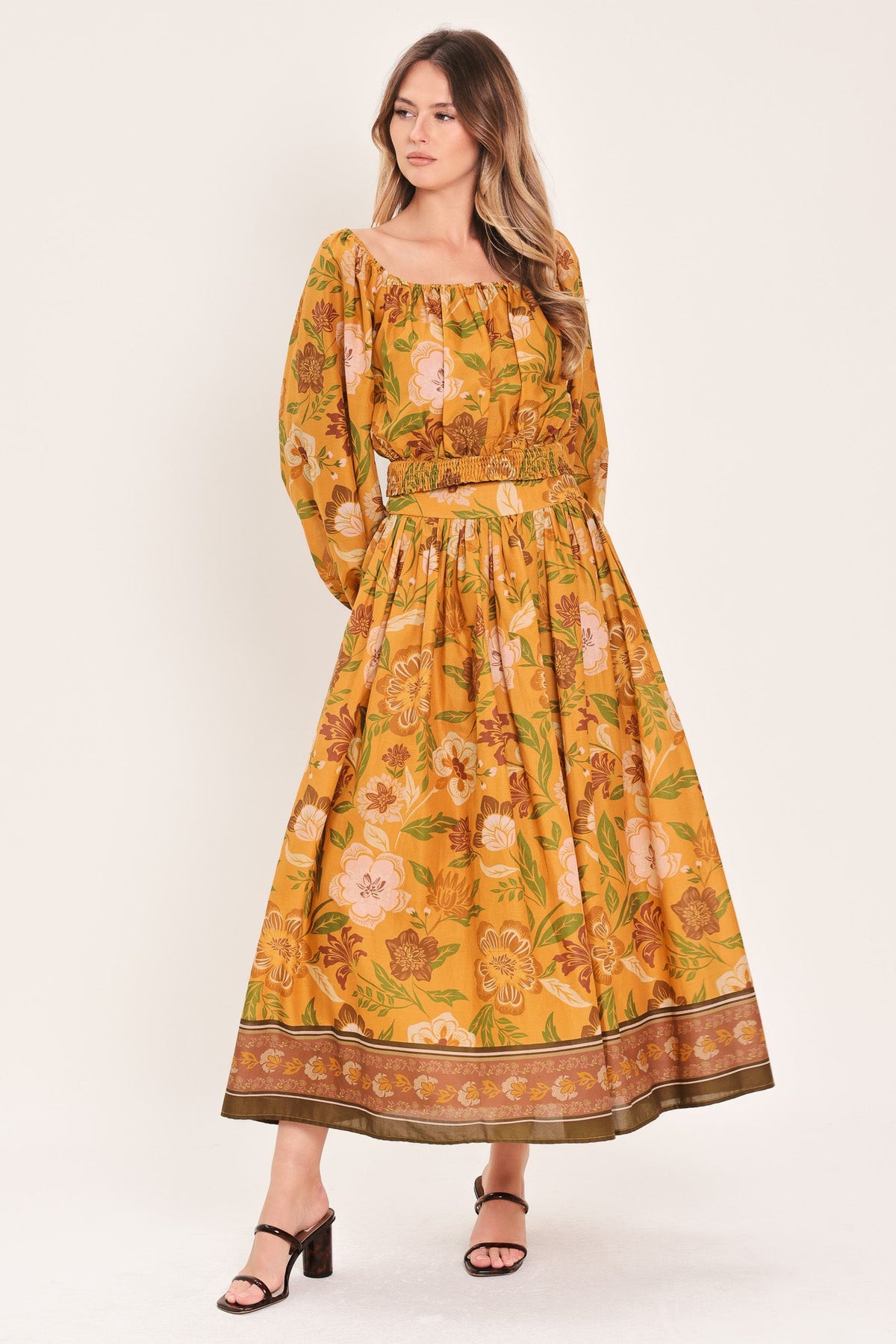 a woman in a yellow dress