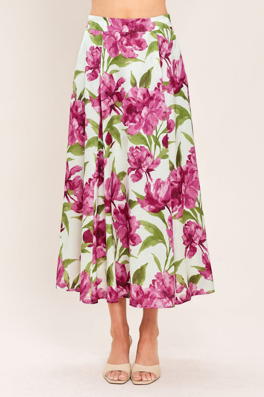a woman wearing a floral skirt