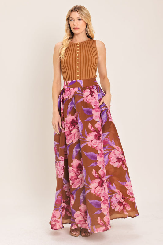 a woman in a long floral skirt