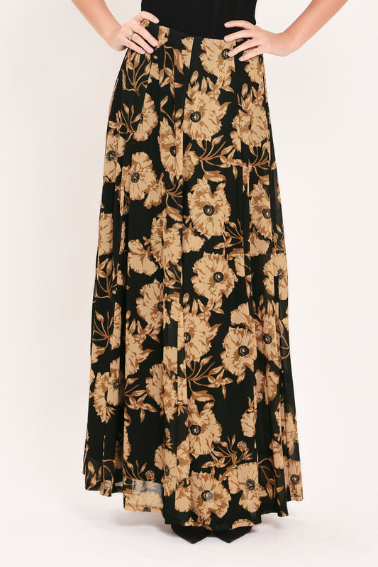 a long black and brown skirt with a floral pattern