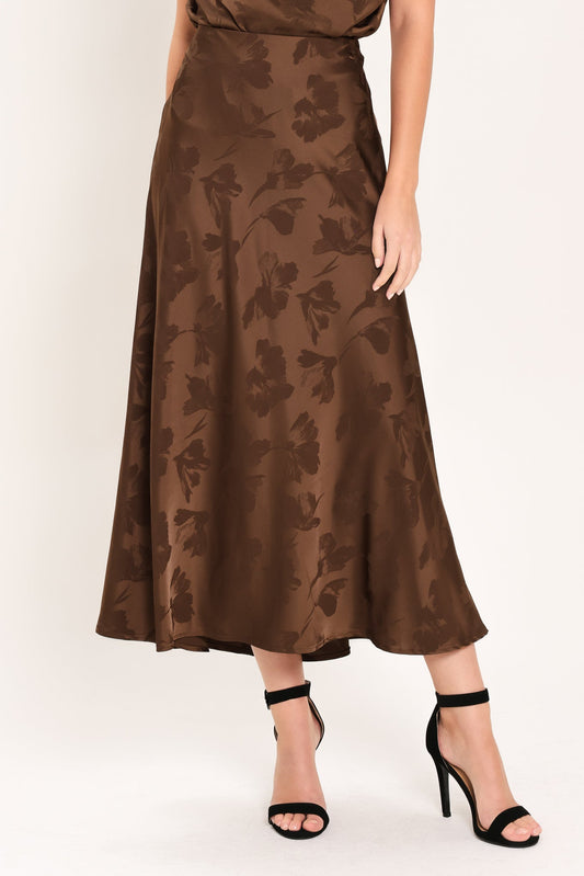 a woman wearing a brown skirt