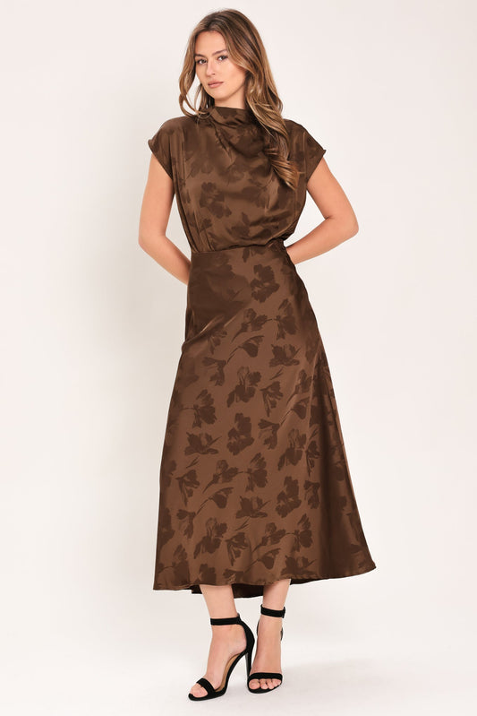 a woman in a brown dress