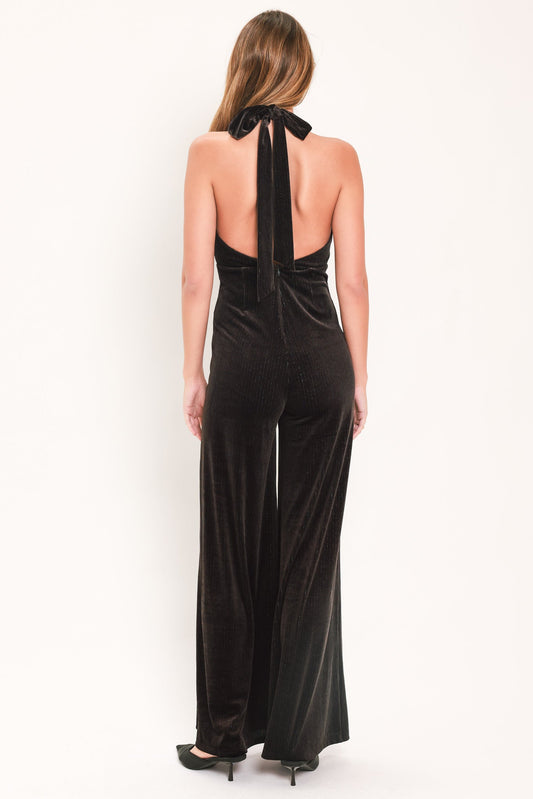 a woman in a black jumpsuit