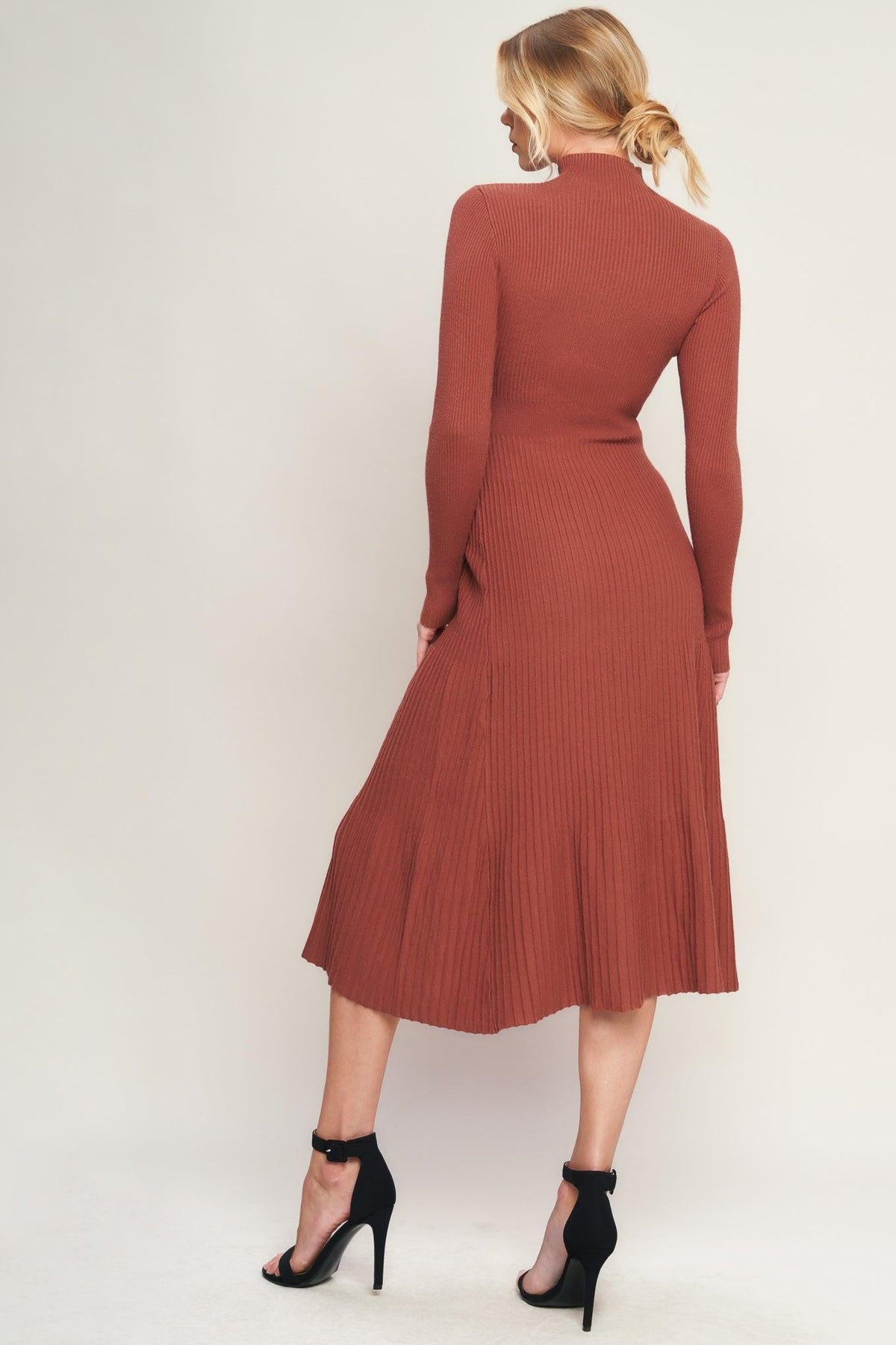 a woman in a brown dress