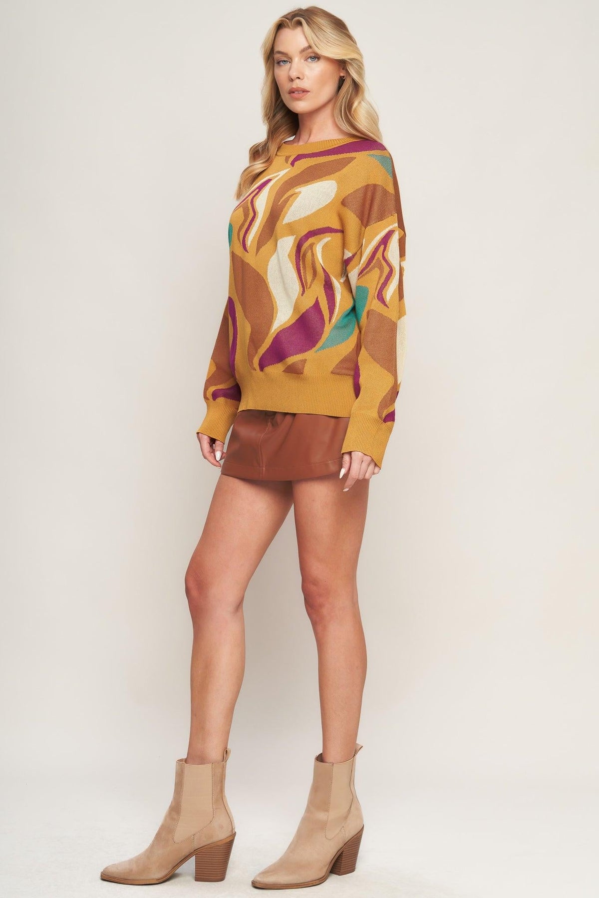 a woman in a brown sweater and brown skirt
