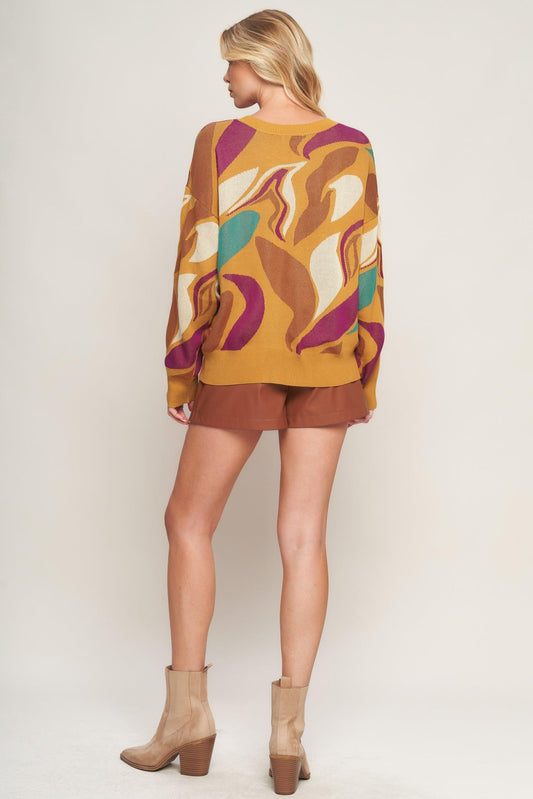 a woman wearing a sweater and shorts