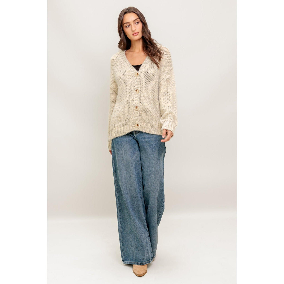 a woman in a sweater and jeans