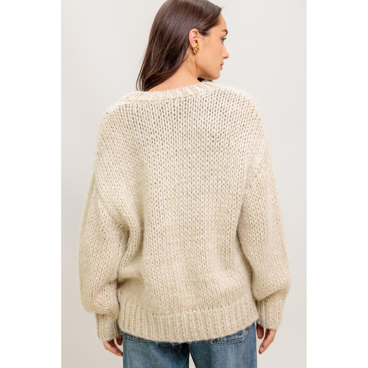 a woman wearing a sweater