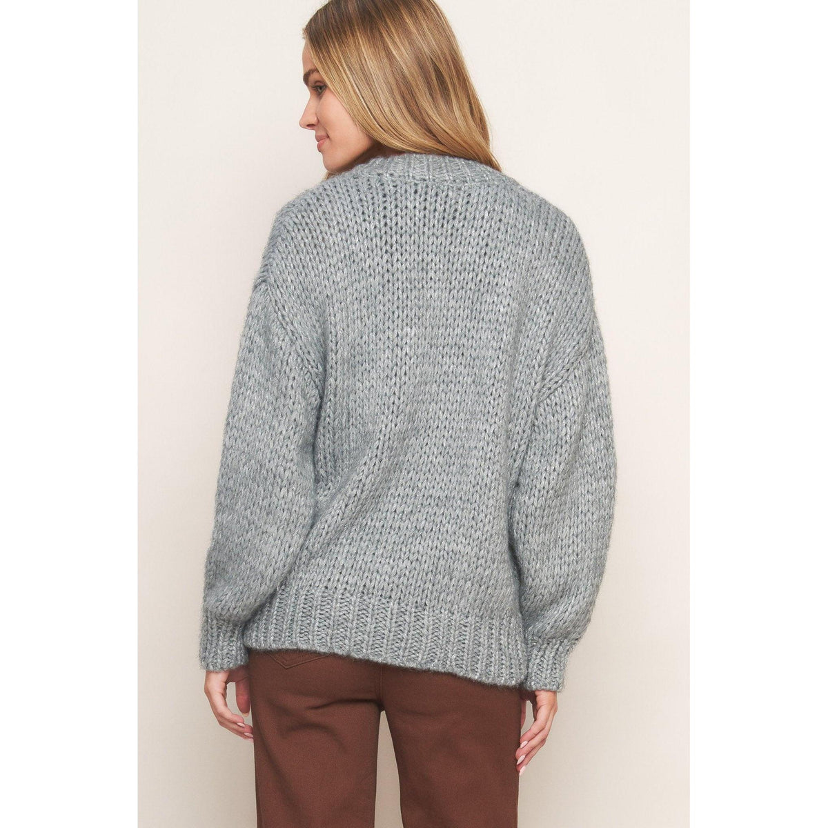 a woman in a sweater