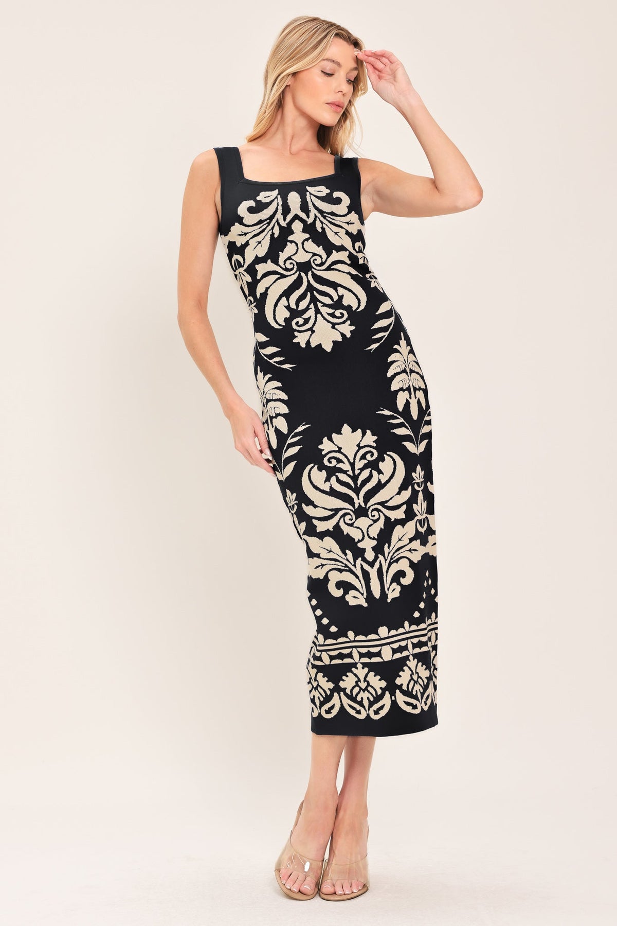 a woman in a black and white dress
