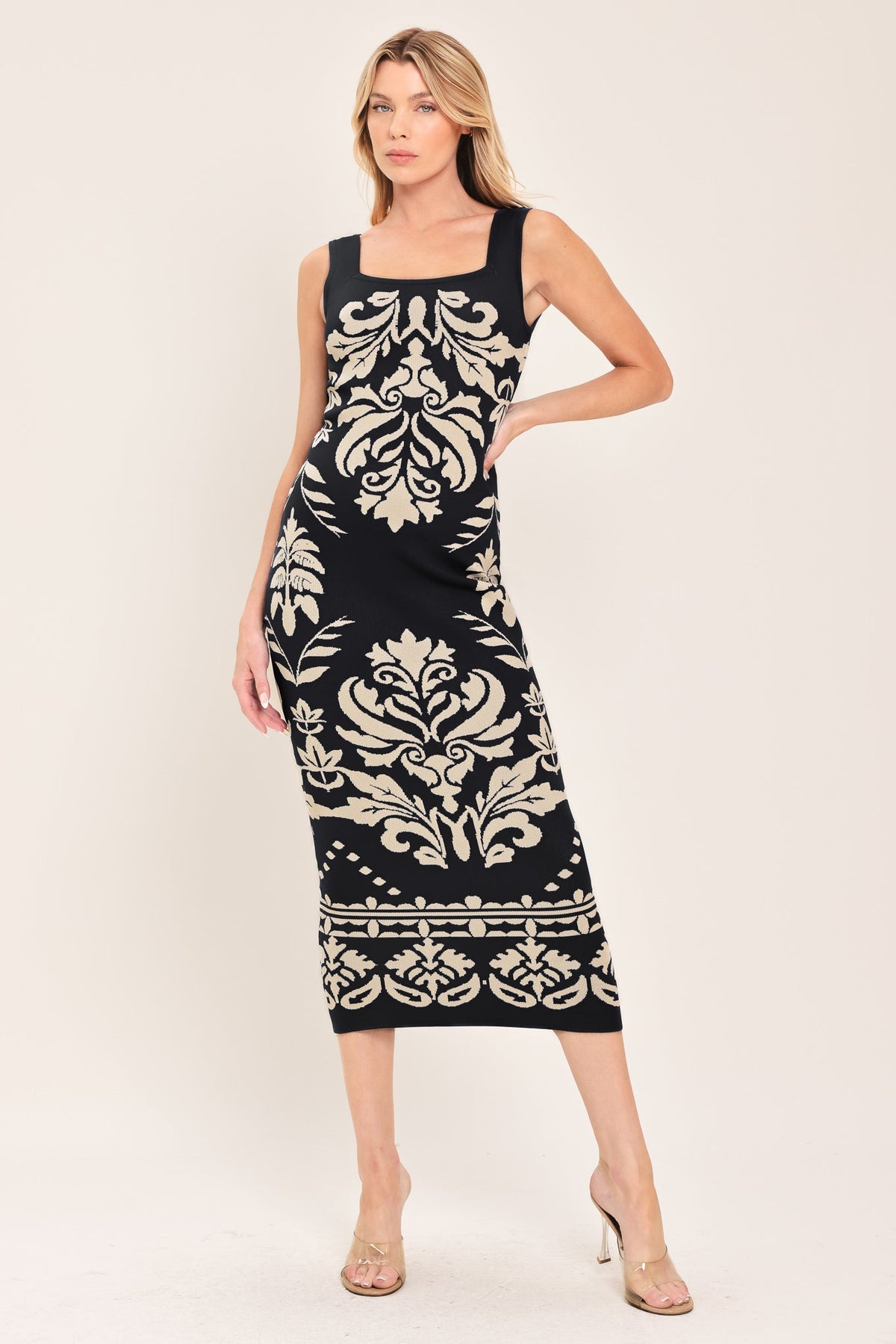 a woman in a black and white dress