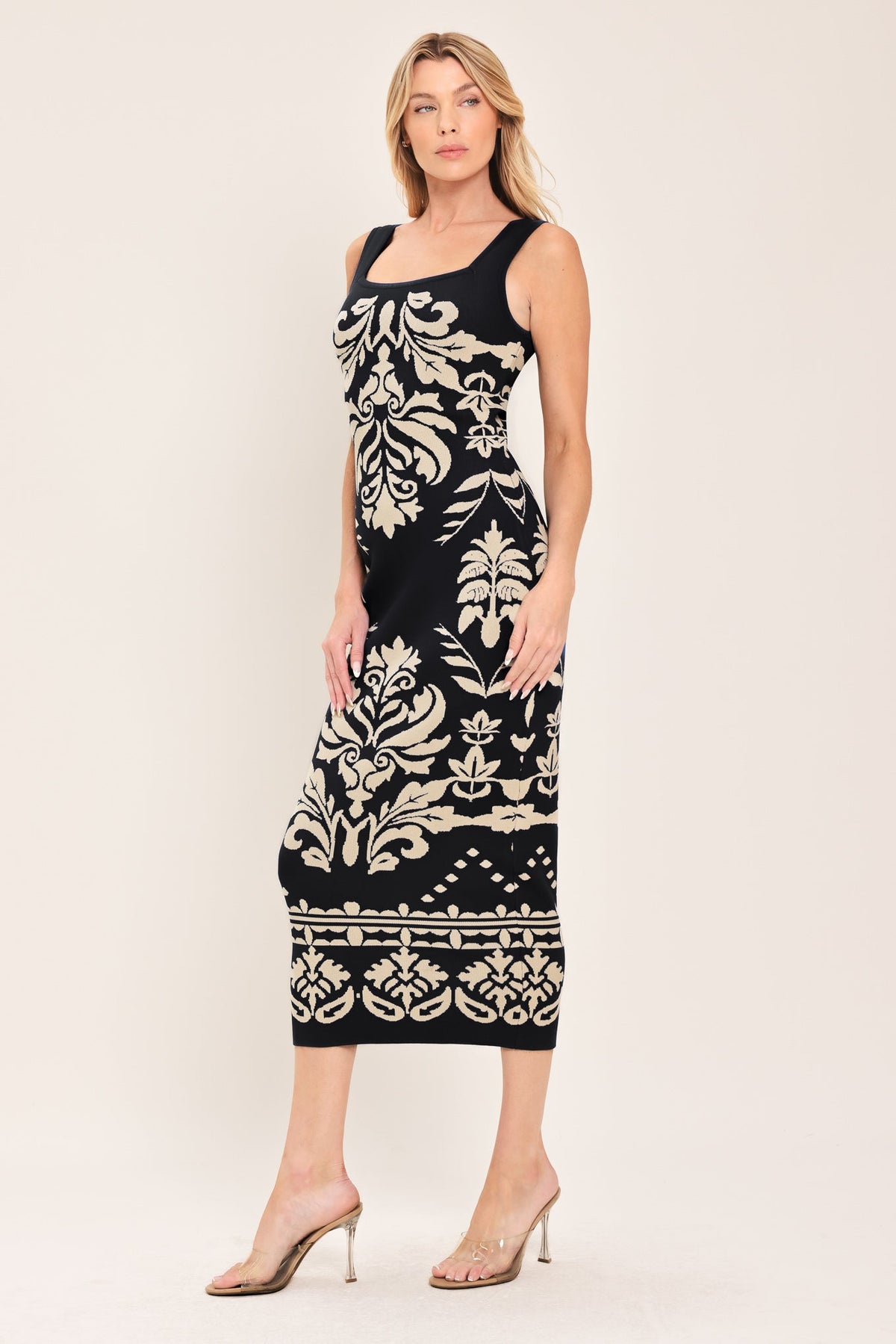 a woman in a black and white dress
