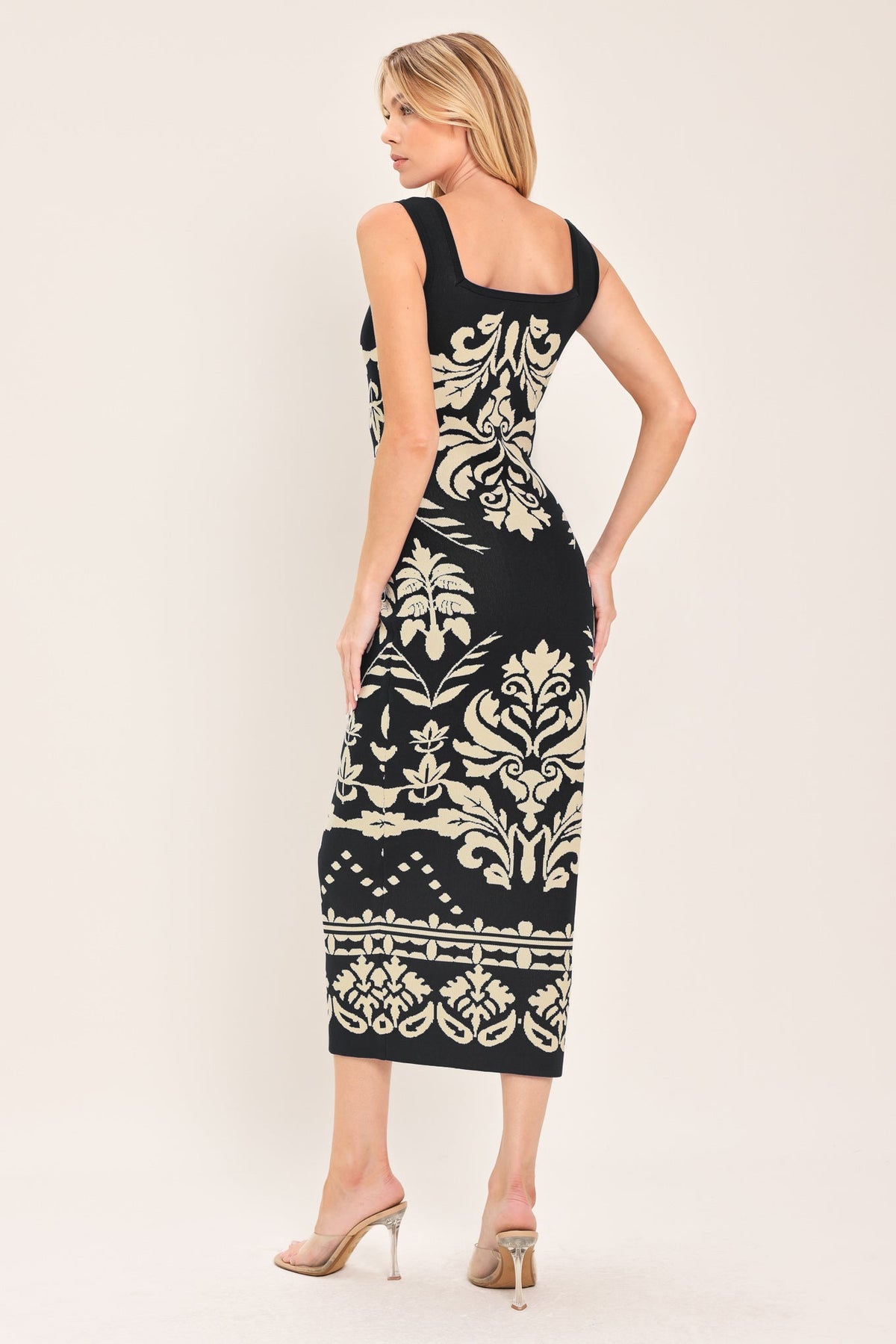 a woman in a black and white dress