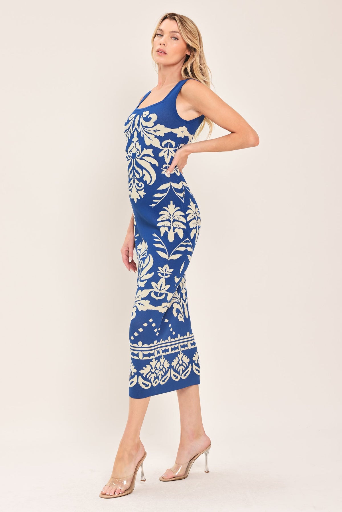 a woman in a blue and white dress