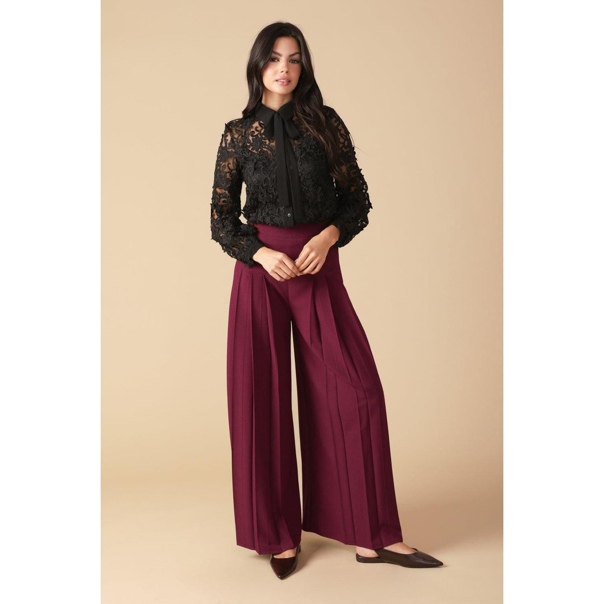 a woman in black shirt and red pants