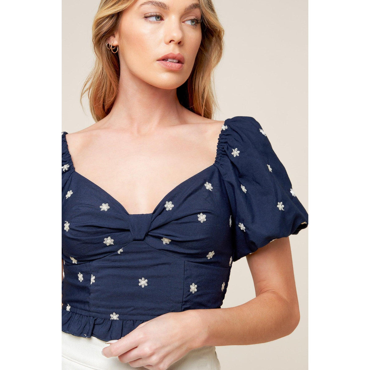 a woman in a blue top
