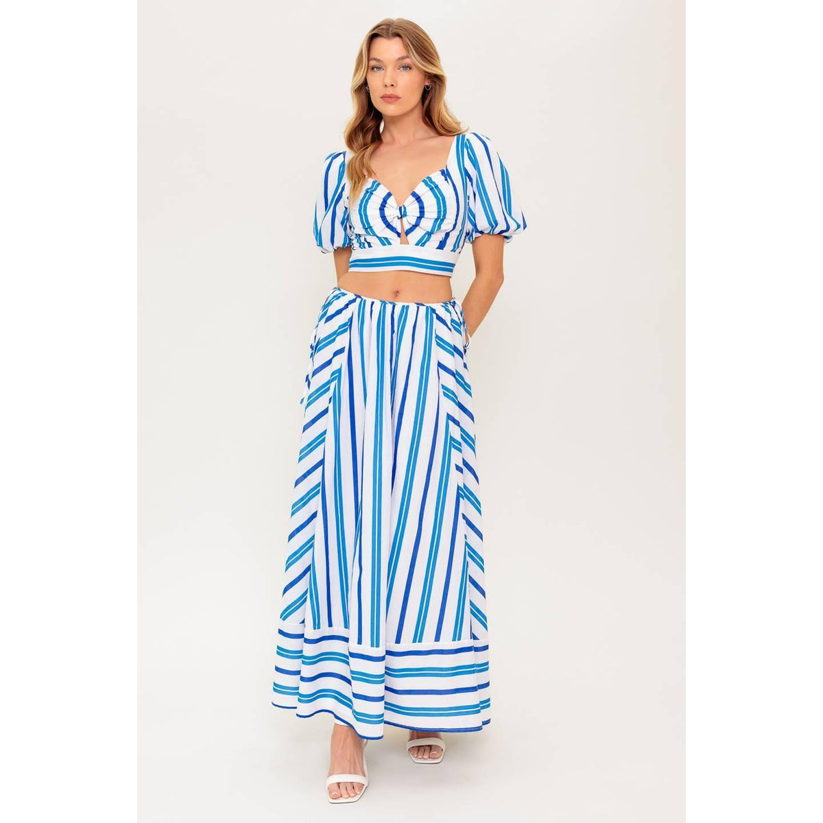 a woman in a blue and white striped dress