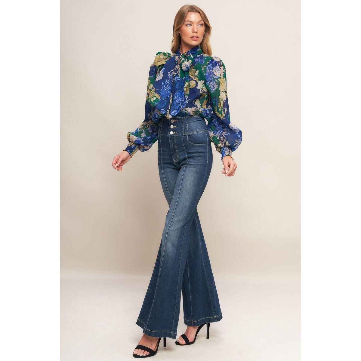 a woman in a floral shirt