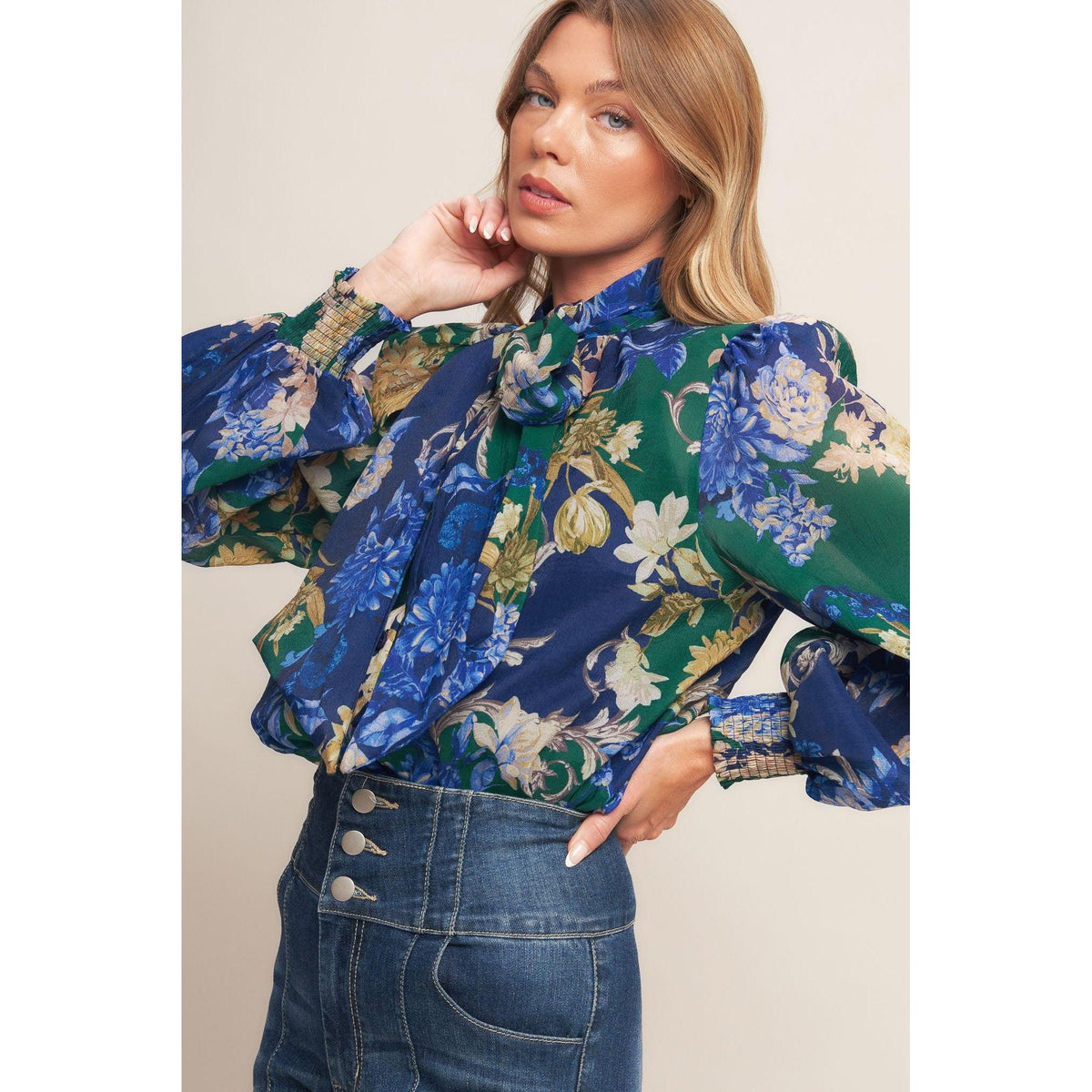 a woman in a floral shirt