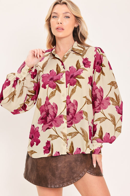 a woman in a floral shirt