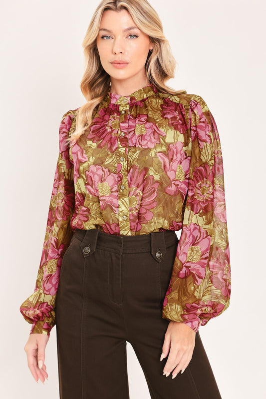 a woman in a floral blouse