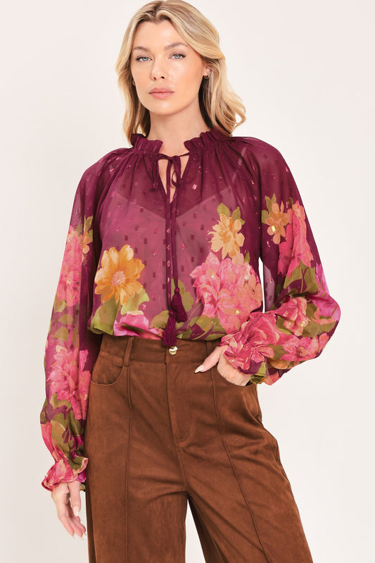 a woman in a floral shirt