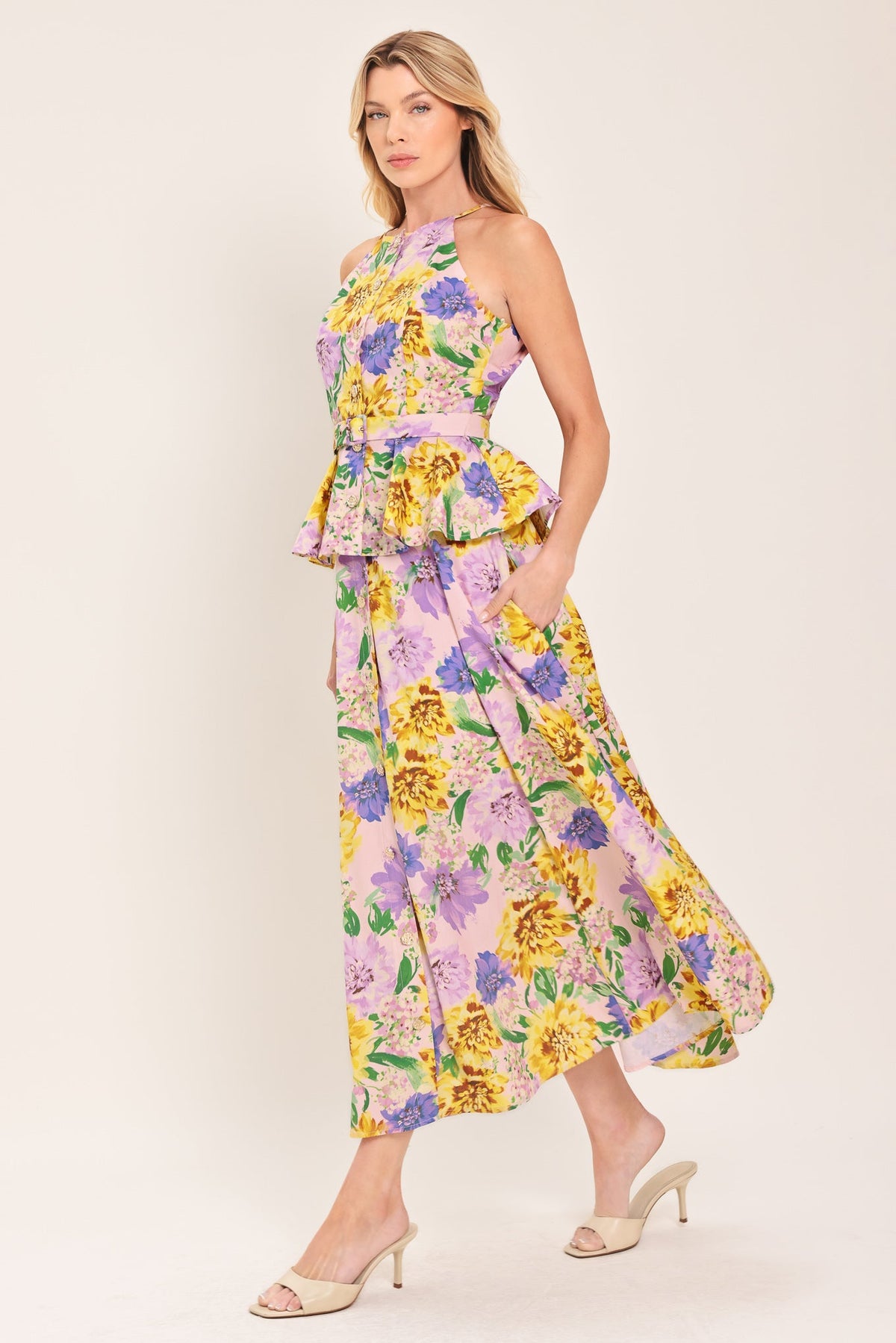 a woman in a floral dress