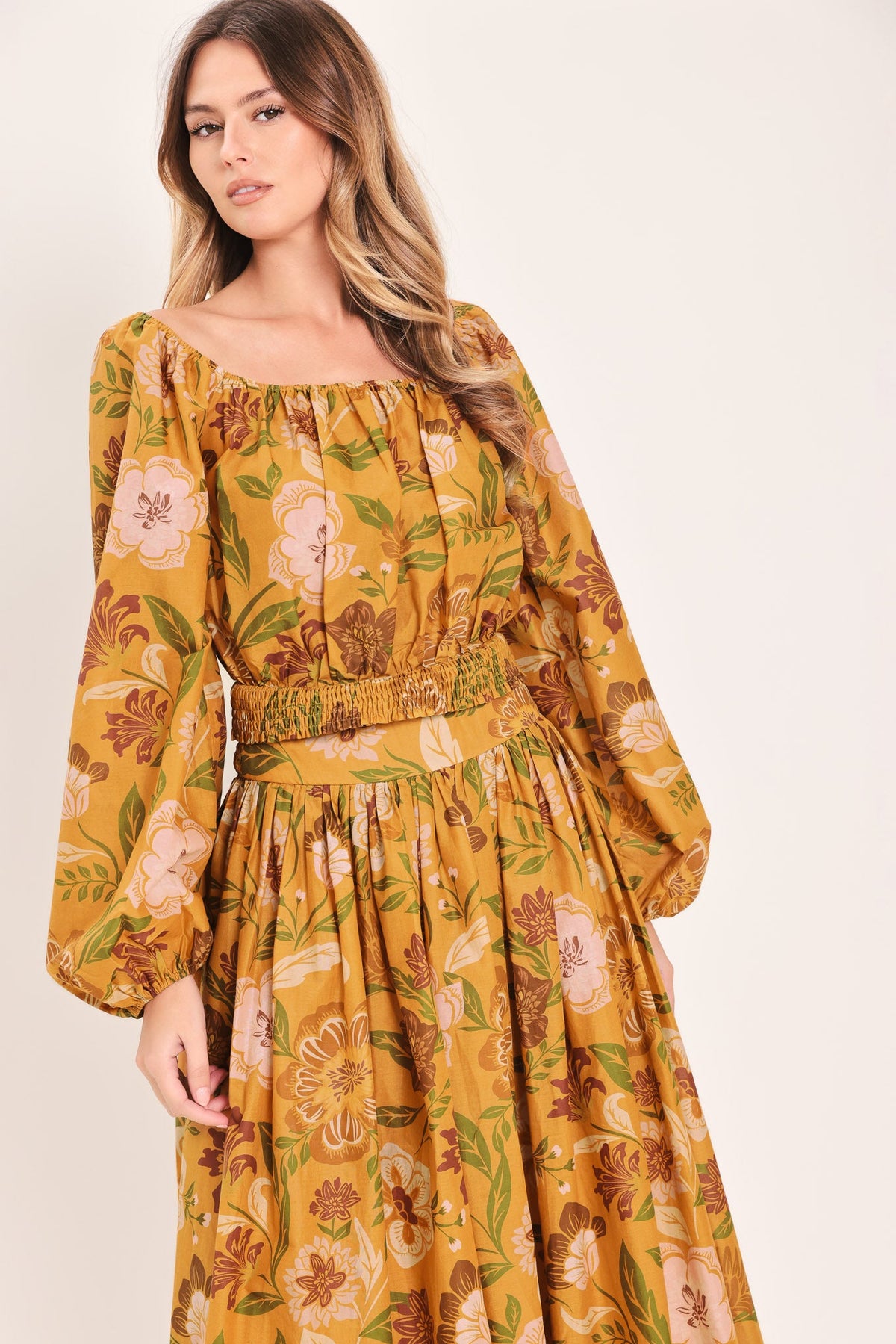 a woman in a yellow dress