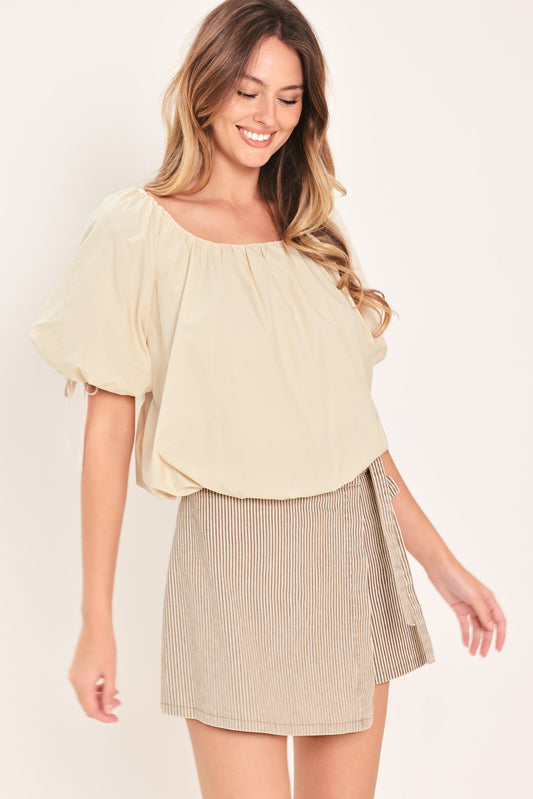 a woman in a skirt and a blouse