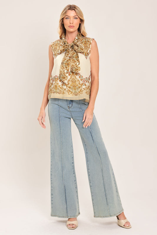 a woman in a blouse and jeans
