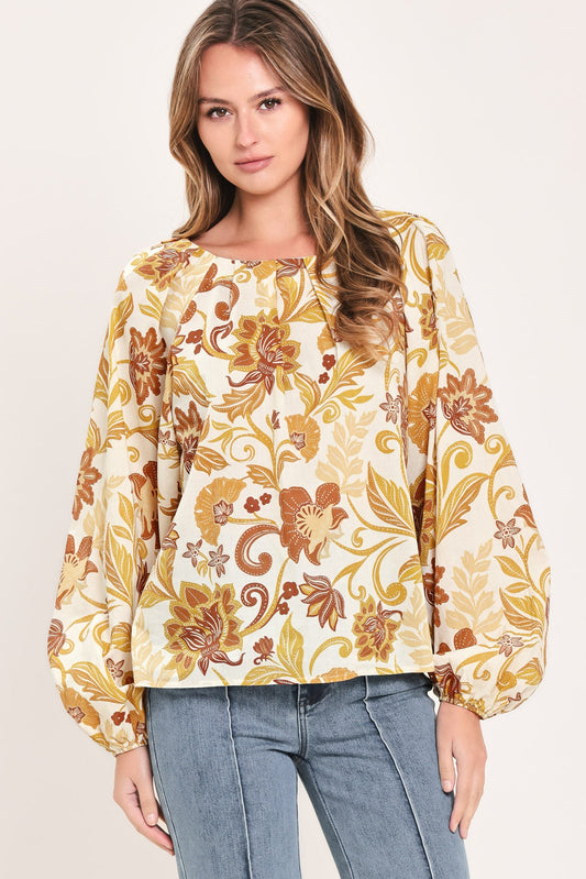 a woman wearing a floral shirt