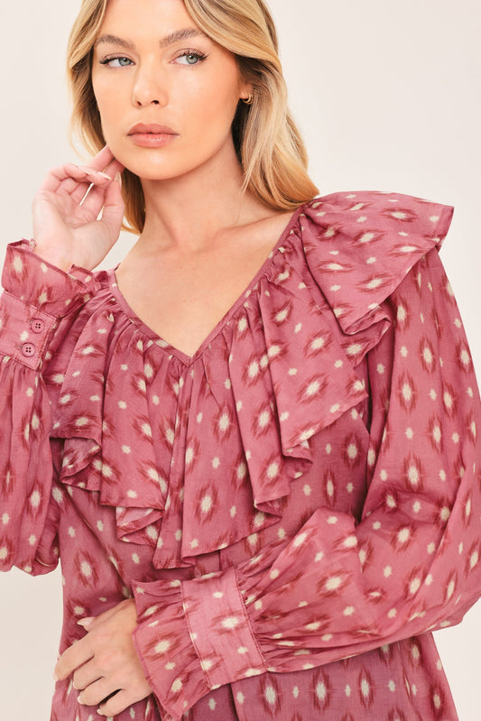 a woman wearing a pink shirt