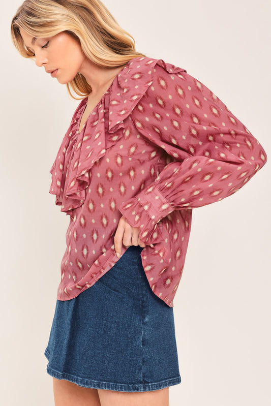 a woman in a pink blouse