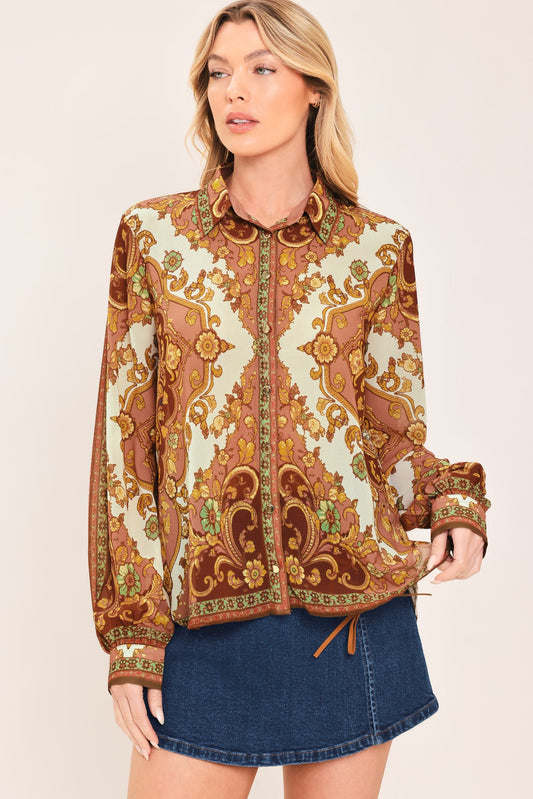 a woman wearing a floral shirt