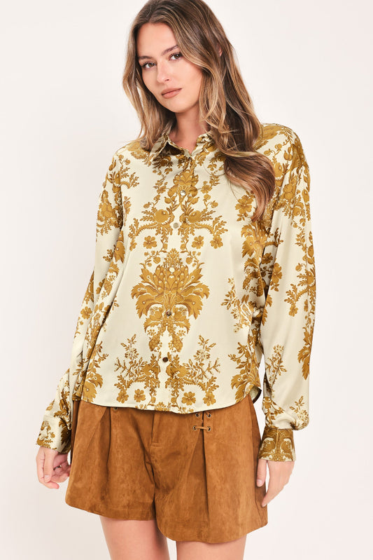 a woman in a floral shirt
