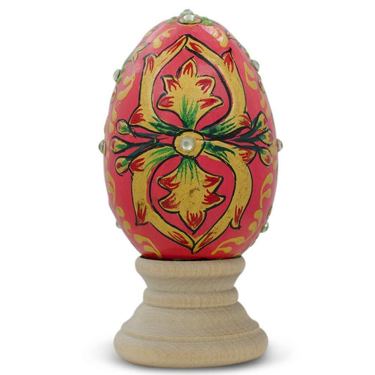 a painted egg on a stand