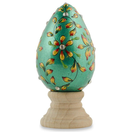 a green egg with a flower design on it