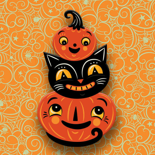 a stack of pumpkins with faces
