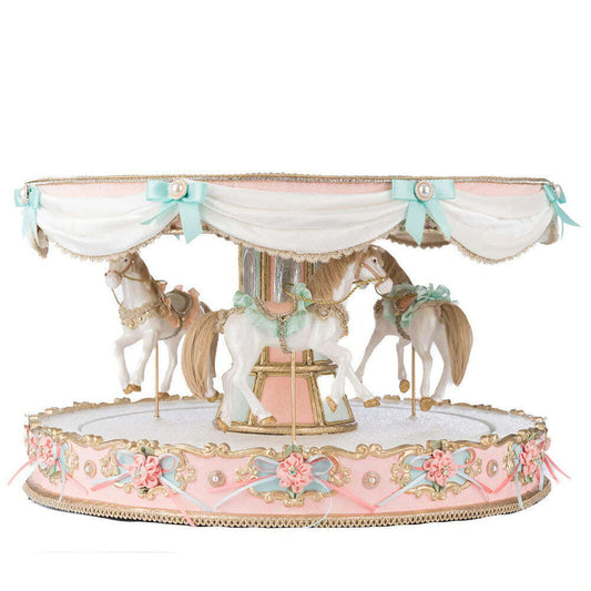 a carousel with horses on top