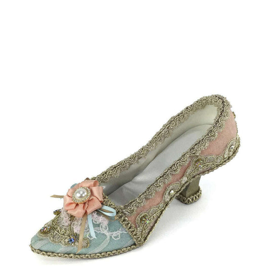 a shoe with a flower on it
