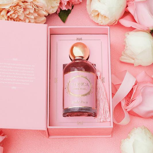 a bottle in a box with flowers