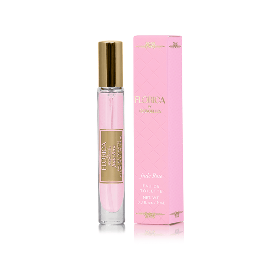 a pink perfume bottle and box