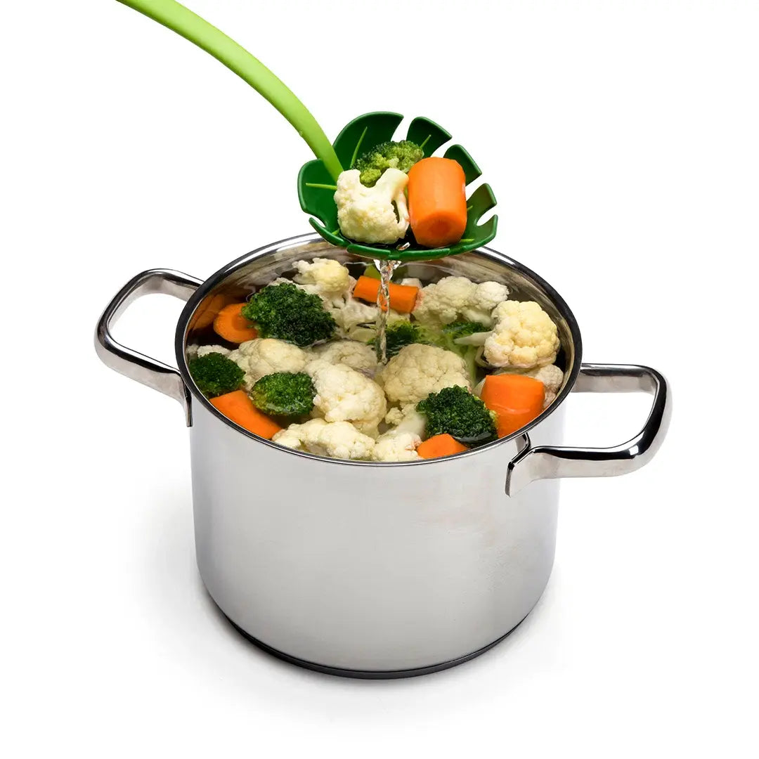 a pot with vegetables in it