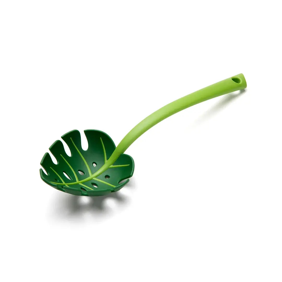 a green leaf shaped spoon