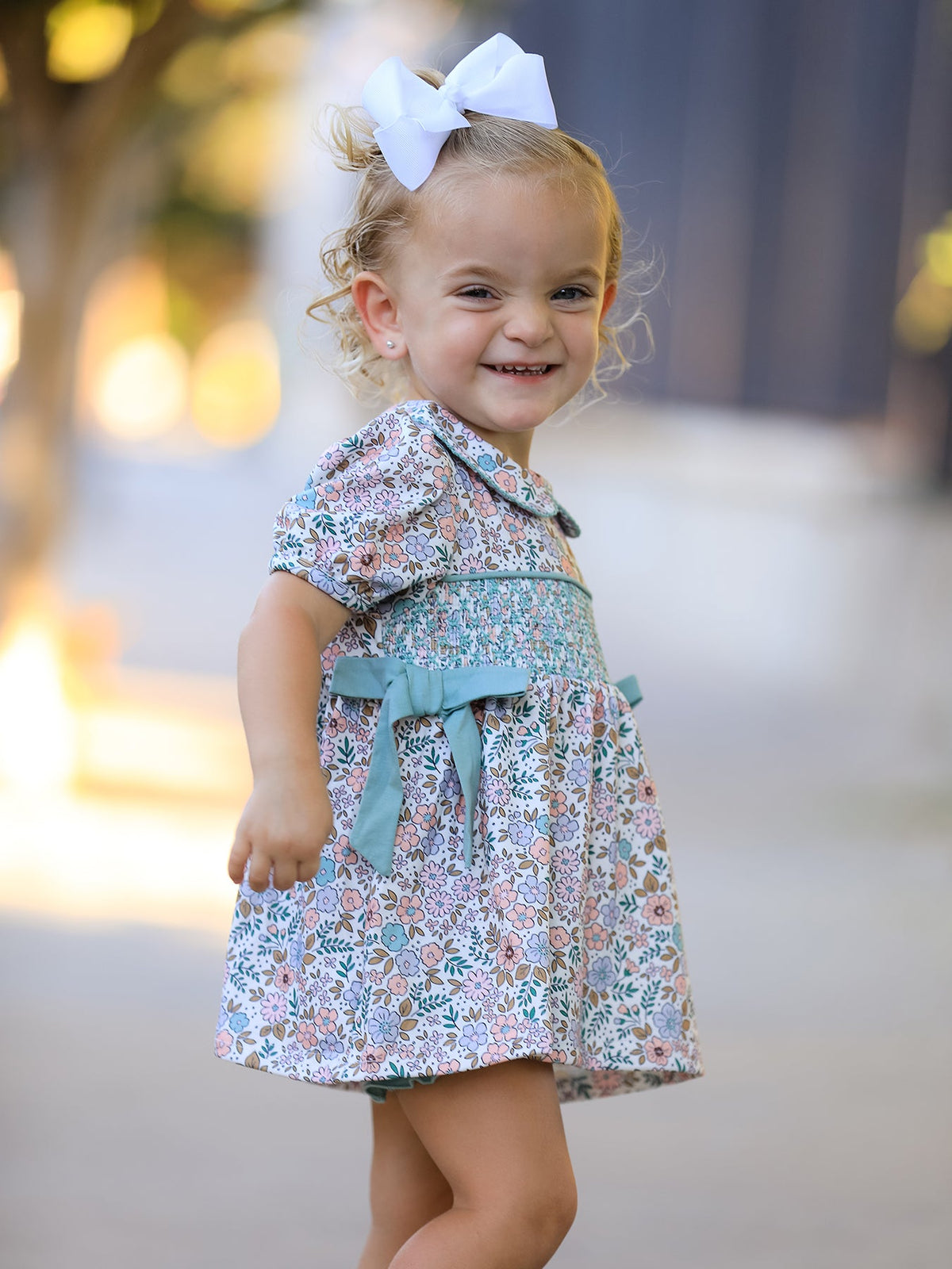 a girl smiling at the camera